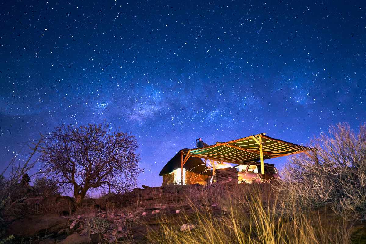 The campsite was illuminated by a slither of the moon and a milky-way-filled night sky.