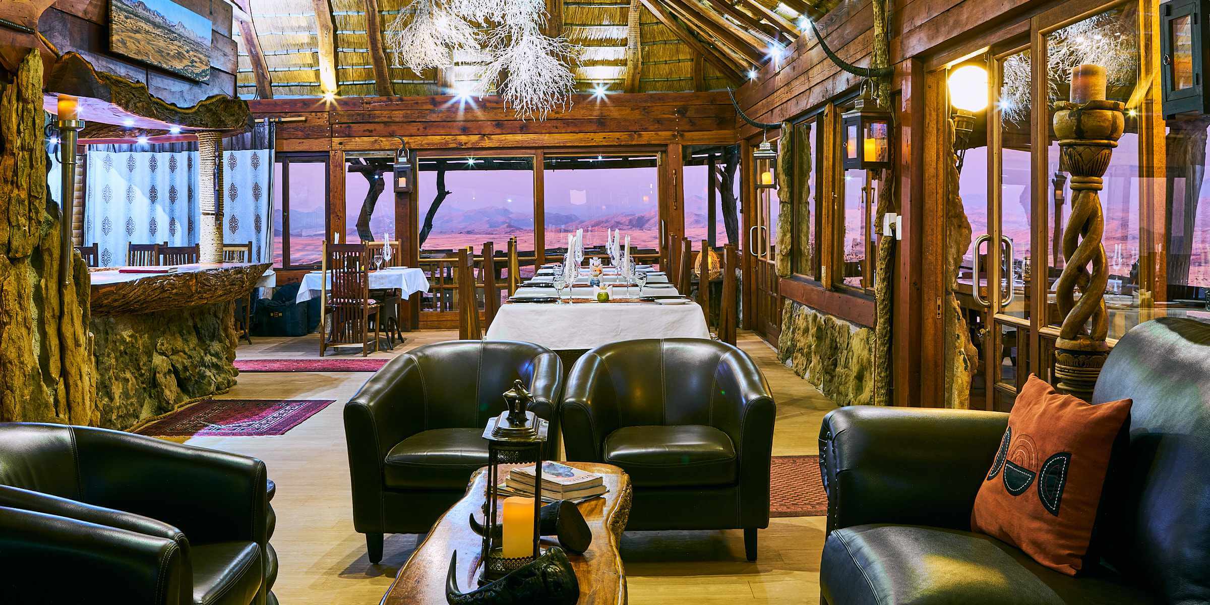 The lodge's restaurant with the pink hues of dusk in the windows